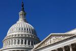 The dome of the U.S. Capitol building with sky in the background.