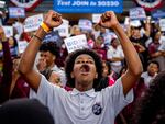 A member of the audience cheers as President Biden speaks during a campaign rally at Girard College on May 29 in Philadelphia. Biden has since dropped out of the race in favor of Vice President Harris and this event launched a nationwide campaign to court Black voters, a group that has traditionally come out in favor of Biden, but their support projected lower for him than it was in 2020. Harris' stake with the group is yet to be seen.