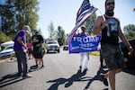 E. Malcolm Slaughter tries to talk with a counter-protester outside Jefferson Davis Park in Ridgefield, Washington, during a protest in support of Black Lives Matter. The park sits on private property off Interstate 5 and includes Confederate, Gadsden, Mississippi and American flags.