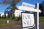 FILE - A sign is posted for a new home for sale in Ambler, Pa., Oct. 16, 2025.