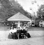 In this photo, circa 1905, a group of visitors enjoy a day at "The Oaks" amusement park.