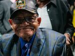 Hughes Van Ellis, one of the last known survivors of the Tulsa Race Massacre of 1921, has died at age 102. He's seen here smiling at a rally commemorating the 100th anniversary of the massacre in June 2021 in Tulsa, Okla.