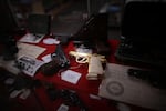 A gold pistol sits at the center of a display of rare and collectible handguns Tuesday at Northwest Armory in Portland, Ore. The high-end gun store sells handguns, hunting rifles and more to customers willing to go through a background check.