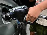 A man pumps gas in Alhambra, Calif., on Oct. 2, 2023.