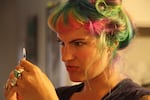 Mardi Palan prepares to inject herself with Lupron. It’s used to  stop her from ovulating. 