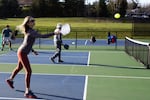 Real estate agent Lene Wells plays a game of pickleball at the Tanner Creek Park courts on Feb. 10, 2023. 