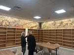Two visitors take in the Kenneth Callahan mural in the Washington Room of the reopened Joel Pritchard Building.