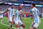Argentina's Alexis Mac Allister, center, celebrates scoring their first goal with Lionel Messi during the World Cup quarterfinal soccer match between Argentina and Switzerland in Kansas City, Mo., Saturday, July 11, 2026.