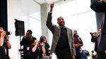 U.S. Sen. Raphael Warnock, D-Ga., waves to supporters as arrives to speak at a campaign rally at Georgia Tech Monday, Dec. 5, 2022, in Atlanta.