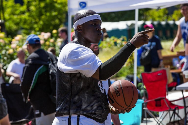Davante Hardy celebrates after hitting a contested layup and drawing a foul during the Rip City 3-on-3 Basketball Tournament. Hardy was one of several Special Olympics athletes competing this year.