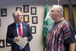 Bud Pierce, left, on the campaign trail in September. Pierce revoked his endorsement of Republican presidential candidate Donald Trump Sept. 20.