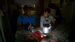 The Johnsons use electric lanterns to prepare a meal in the dark at their home in Southeast Portland.