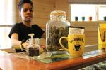 Portia Mittens, co-owner of Sumpter's second dispensary The Coughie Pot, shows off some of her products. 