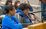 Portland Association of Teachers President Angela Bonilla, right, speaks at the Portland Public Schools Board of Education special meeting where the board unanimously passed a contract with PAT, at the PPS district offices in Portland on Tuesday. PAT, the largest group of educators in the district, voted to ratify the tentative agreement earlier in the day, with a vote of 94.7% in favor.