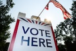 Signage directs voters at a polling place in White Bear Township, Minn., on Aug. 11.