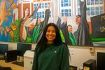 Citlaly Arroyo-Juarez stands in front of her favorite mural in Portland State University's La Casa Latina Student Center. Arroyo-Juarez is graduating from PSU this weekend.