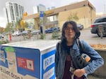 Ember Chow, 24, cast a friend’s ballot at a ballot drop box in the U District on Election Day.