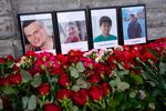 Flowers and portraits are placed at the Consulate of Azerbaijan in St. Petersburg, Russia, on Thursday in memory of victims of the Azerbaijan Airlines Embraer 190 that crashed near Kazakhstan's airport of Aktau.