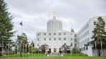 The Oregon Capitol sits behind the "Walk of Flags" in Salem, Oregon, Saturday, March 18, 2017.