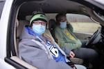 Marcie Varnell waits in her car to get at COVID-19 test at a pop-up testing site in Southeast Portland, Jan. 6, 2022. Varnell was feeling ill and found out that she had been exposed to the virus while at work. 
