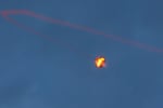 Sun. Oct. 8: An Israeli missile launched from the Iron Dome defense missile system attempts to intercept a rocket, fired from the Gaza Strip, over the city of Netivot in southern Israel.