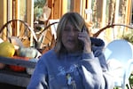 Theresa Draper, of the Draper Girls Country Farm & U-Pick Orchards, deals with staff on the phone at her farm in Parkdale, Ore., Oct. 6, 2025.