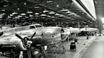 A row of B-17 bombers being assembled by Boeing workers at a Seattle plant during World War II.