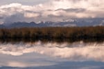 Pastures adorn the landscape along the Nodales River, creating a reflection at sunset. Patagonia, Chile, on Sunday, November 3, 2024. Tamara Merino for NPR.