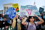 In this March 4, 2020, file photo, abortion rights demonstrators rally outside the Supreme Court in Washington. Among abortion-rights activists, there's relief and optimism as the Biden administration takes power Biden is expected to soon issue executive orders reversing anti-abortion actions taken by Trump.