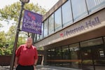 Associate dean of nursing Paul Smith stands outside Peterson Hall on the Linfield College nursing campus in Portland, Ore., Tuesday, Aug. 6, 2019. Linfield purchased a 10-building campus in Portland to host its nursing program.