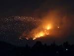 A fire burns on a hillside near Sever do Vouga, a town in northern Portugal that has been surrounded by forest fires, on Tuesday.