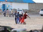 Relatives carry the body of a woman who was killed during an attack in Mogadishu.