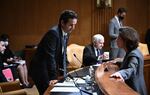 Democratic Sen. Brian Schatz of Hawaii, left, speaks with Commerce Secretary Gina Raimondo, who oversees the Census Bureau, before a Senate Appropriations subcommittee hearing on Capitol Hill in Washington, D.C., in May.