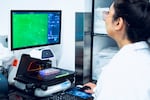 Tie examines cells carrying a genetic mutation that increases the risk for breast cancer that have been injected with one of Origin’s experimental gene editors.