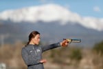 FILE-USA Olympic modern pentathlon team member Isabella Isaksen, seen in practicing target shooting in 2020, will accompany Sen. Jeff Merkley during President Donald Trump's address to a. joint session of Congress on March 4, 2025. Isaksen is a former public affairs officer the U.S. Forest Service in Central Oregon.