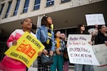 Students hold signs and chant during a March 13 rally in front of the U.S. Department of Education to protest budget cuts.