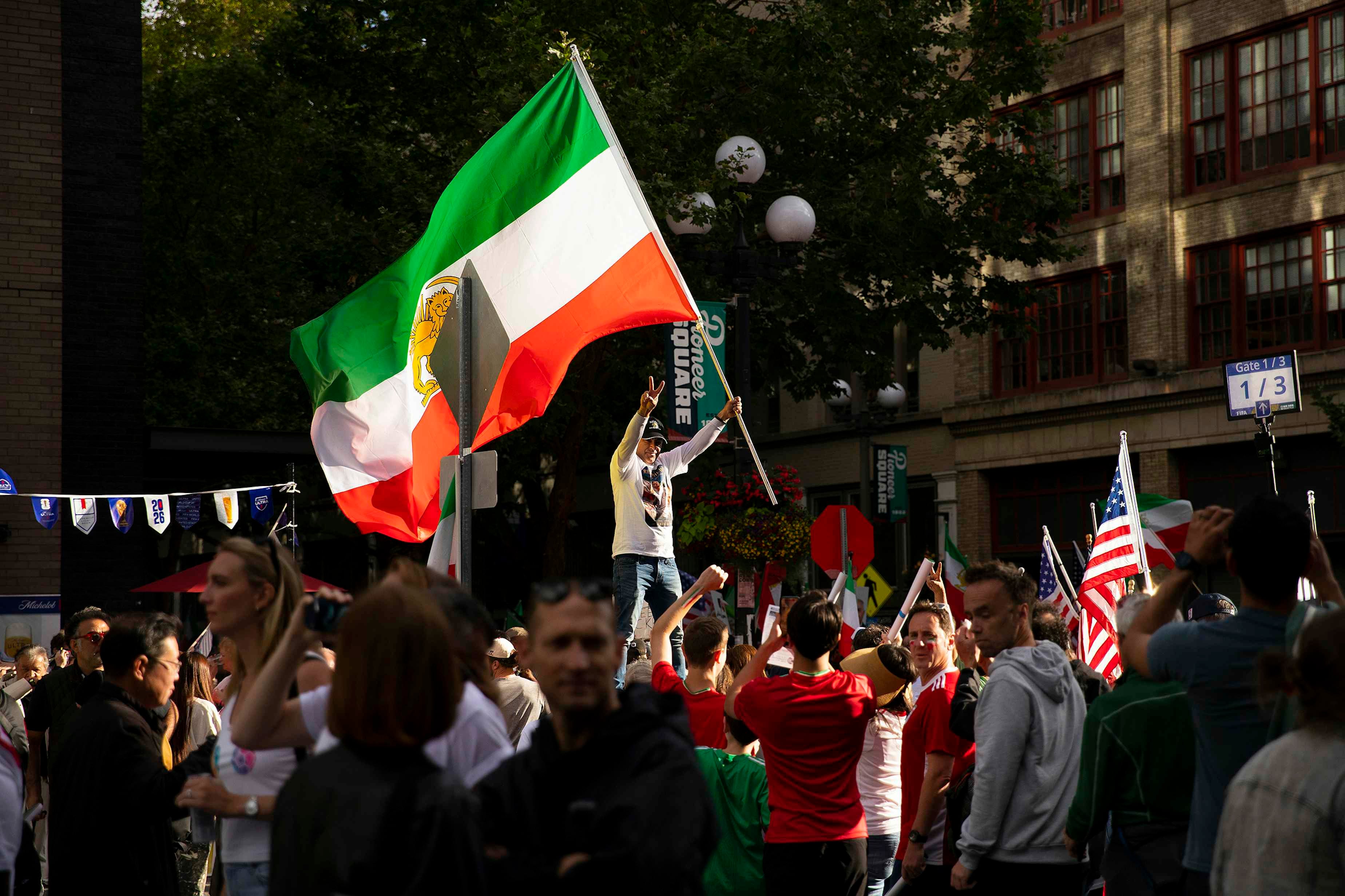Demonstrators protesting the Islamic Republic regime in Iran gather as soccer fans walk toward the stadium ahead of the FIFA World Cup match between Egypt and Iran, on Friday, June 26, 2026, in Seattle.