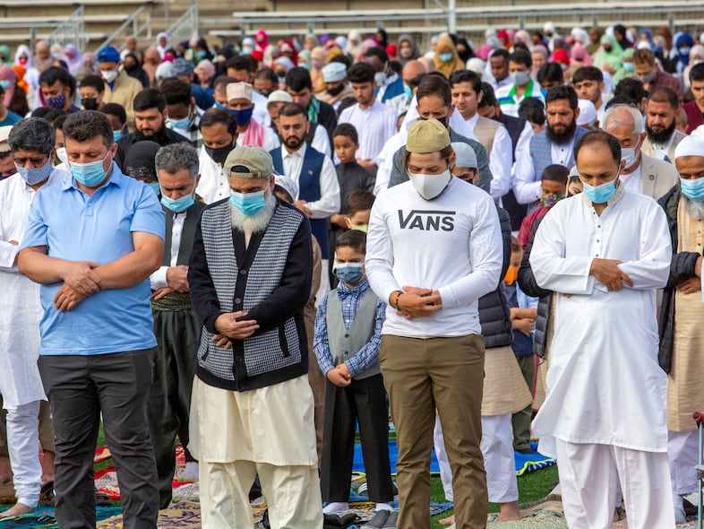 Worshippers stand to pray during the morning service. Eid-Al Adha commemorates the annual Hajj or Pilgramage in Mecca, Saudia Arabia.