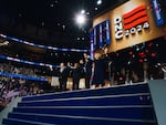 Doug Emhoff, Kamala Harris, Tim Walz and Gwen Walz on stage at the end of the Democratic National Convention.