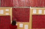 An art installation called "No More Stolen Sisters," an iteration of the Red Dress Project commemorating missing and murdered Indigenous women, is displayed at the University of Oregon in 2019.