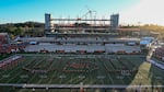 A marching band spells out "O-S-U" on a football field.