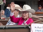 Mary Jane Krier, the 1969 St. Paul Rodeo Queen, waves to crowds during the Fourth of July parade. She said the rodeo is a tradition passed down through generations in St. Paul. Her grandparents worked at the rodeo, and now her grandchildren participate, as well.