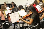 Ashley, a seventh-grader and student in OPB's Class of 2025 project, plays the violin in the school orchestra. With two orchestra classes, she plays her violin every school day.