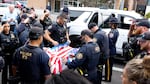 Members of the Portland Police Bureau hold a procession outside of Blue Pearl Pet Hospital for Kylo.