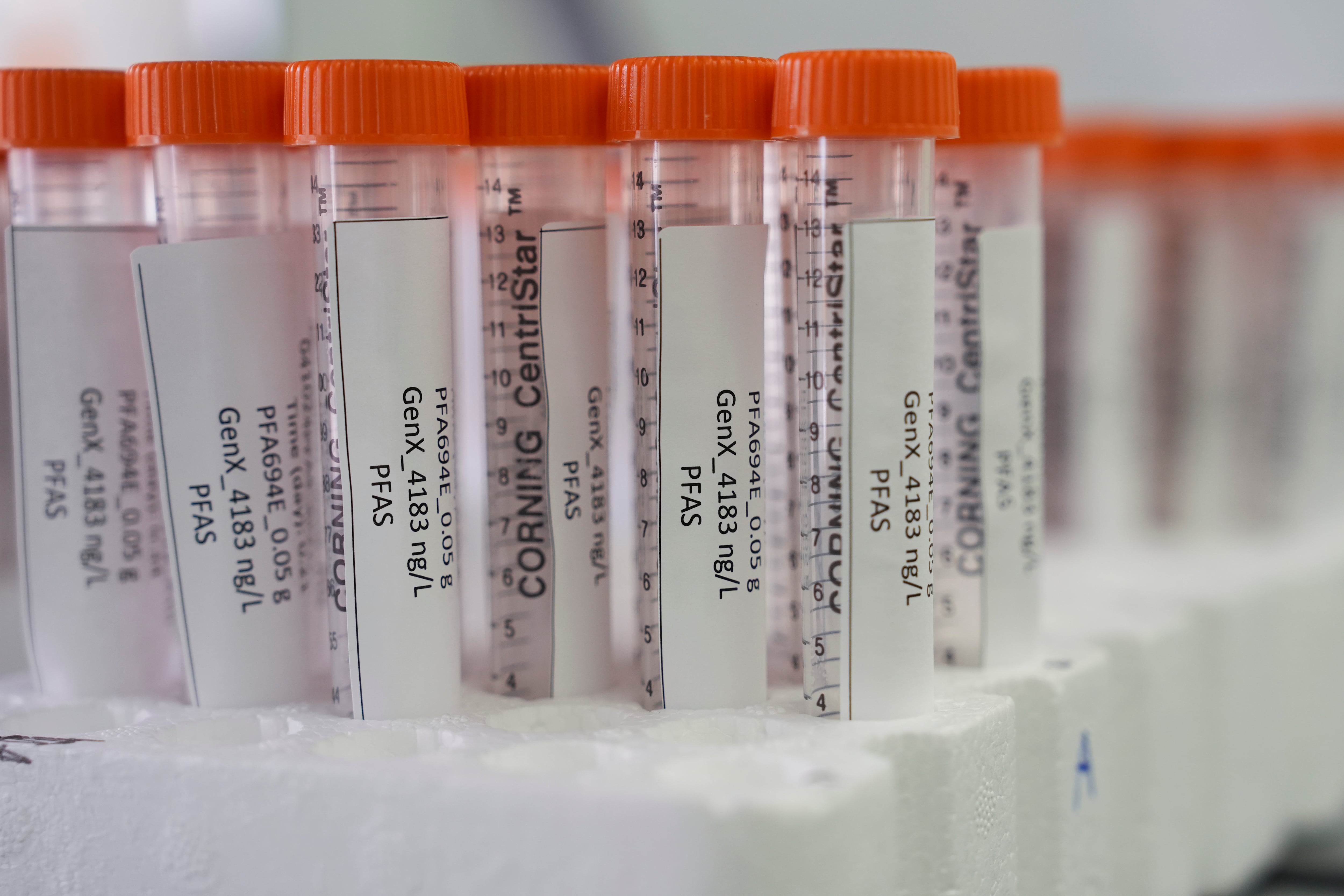 FILE - Vials containing samples of forever chemicals, known as PFAS, sit in a tray, April 10, 2024, at a U.S. Environmental Protection Agency lab in Cincinnati.
