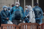 American citizens arrive onshore after being evacuated from the M/V Hondius in the Granadilla Port on Sunday in Tenerife, part of the Canary Islands, Spain.