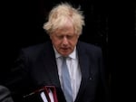 British Prime Minister Boris Johnson leaves 10 Downing Street to attend the weekly Prime Minister's Questions at the Houses of Parliament, in London, Wednesday, May 25, 2022.