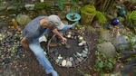 Bale building a round medallion mosaic.