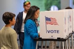 MADISON, WISCONSIN - AUGUST 11: With her son George by her side, Democratic Wisconsin Gubernatorial candidate Francesca Hong votes in the primary election on August 11, 2026 in Madison, Wisconsin.