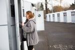 Debbie Maddox stands in the doorway of one of 20 shelters Vancouver opened on Dec. 23. The outdoor shelter is Vancouver's first of three planned.